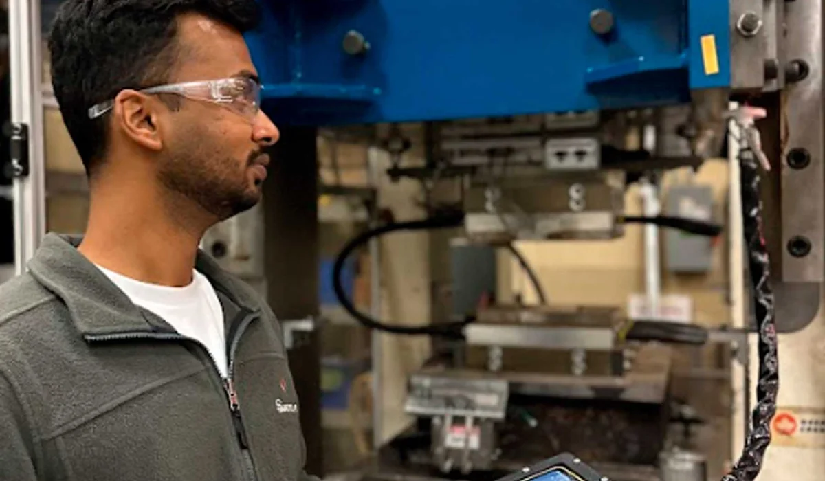 Jesh Ramesh with GreaseTech’s smart grease gun in the article about the company’s origins